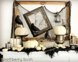 Family Room vintage Halloween Mantel with crowns and white pumpkins
