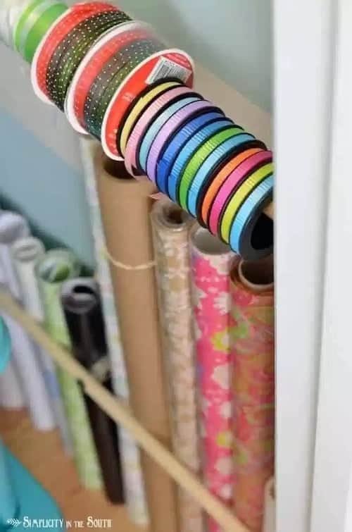 Use dowel rods and curtain rod brackets for wrapping supplies.jpg