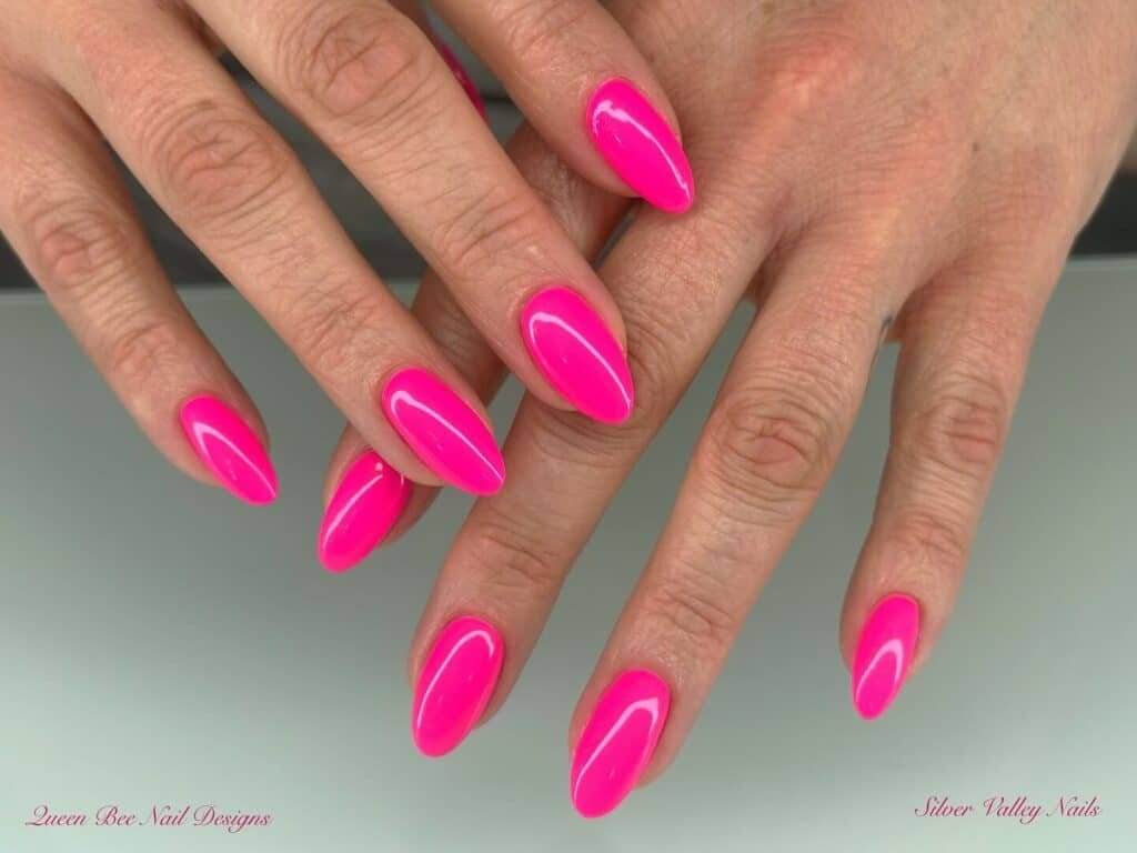 Assortment of summer pink nail colors and styles, featuring vibrant hot pinks, bold neons, and soft pastel pinks, ideal for chic summer nails.