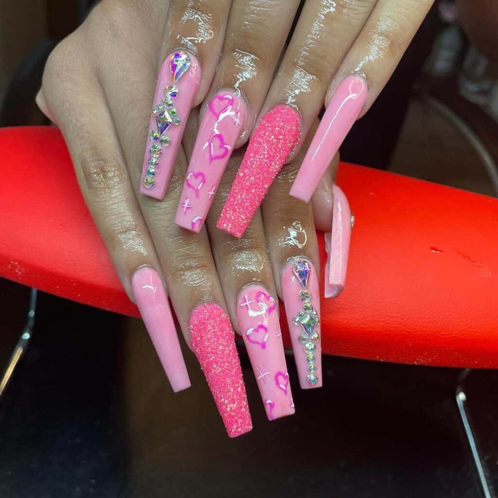 Explore a variety of pink nail designs, from bright and cute styles to festive Christmas nails with intricate patterns and decorations.