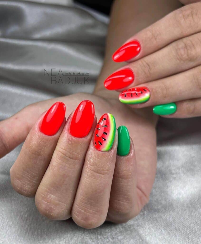 Cheerful watermelon nails with vivid summer shades of pink and green, highlighted by fun black seed accents, ideal for a refreshing summer style.